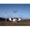 DJI Dock 4 ouvert avec drone Matrice 5TD en vol sur un site de lignes électriques